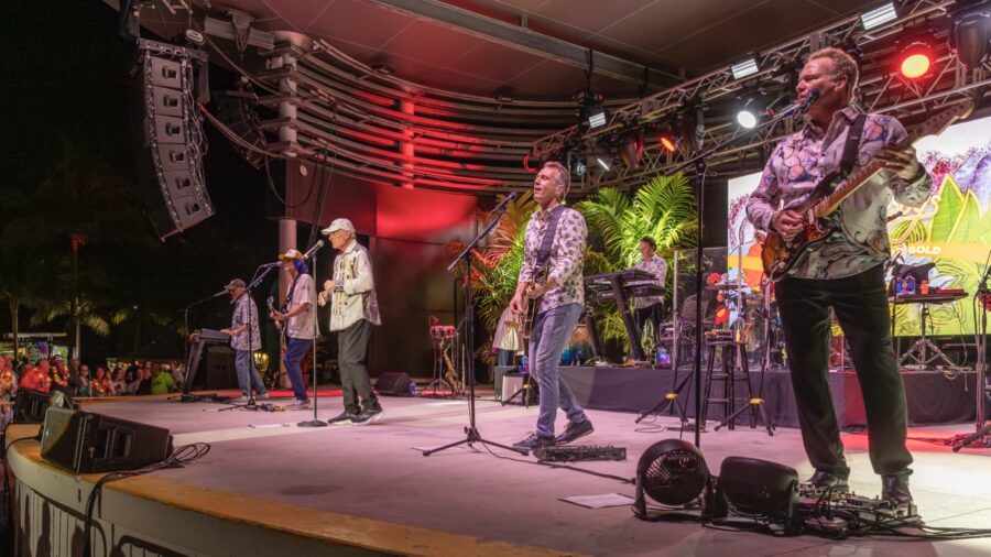 a group of people standing on top of a stage