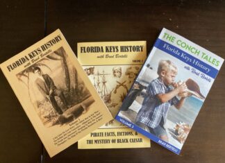 a collection of florida keys books on a table