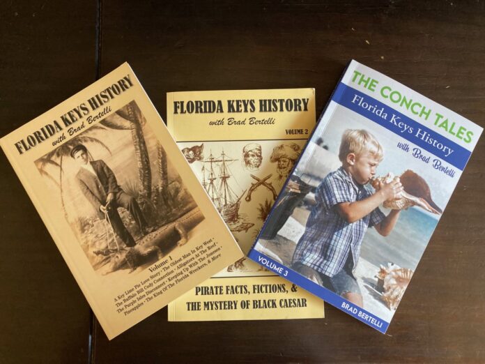 a collection of florida keys books on a table