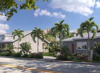 a row of houses on a street with palm trees