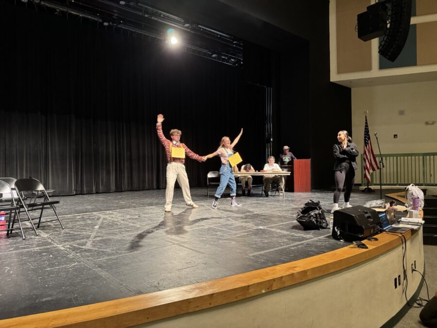 a group of people standing on top of a stage