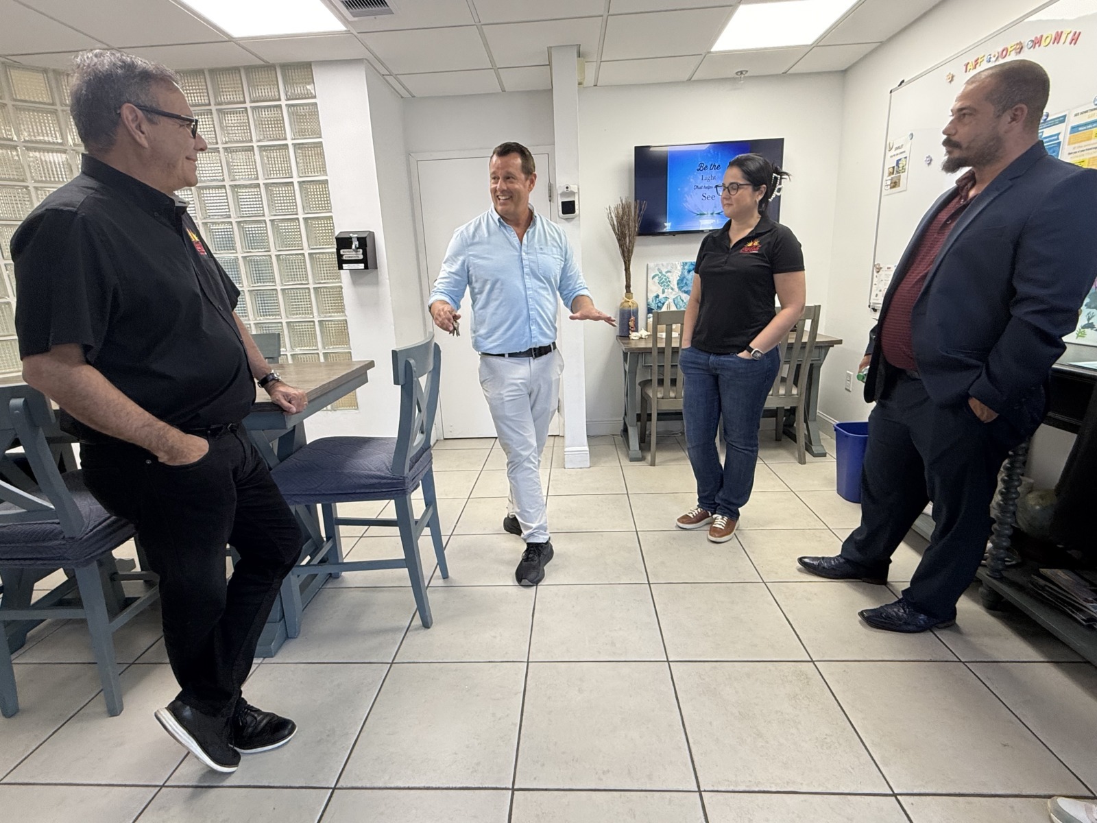 a group of people standing in a room