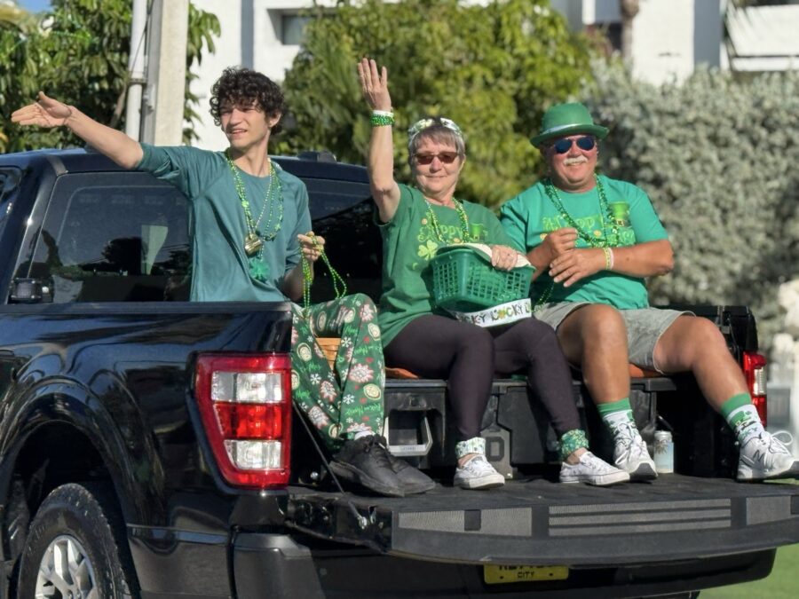 a group of people riding in the back of a truck