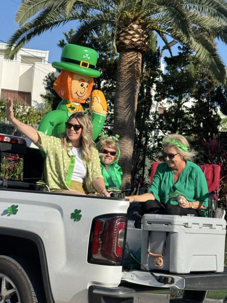 a group of people riding in the back of a truck