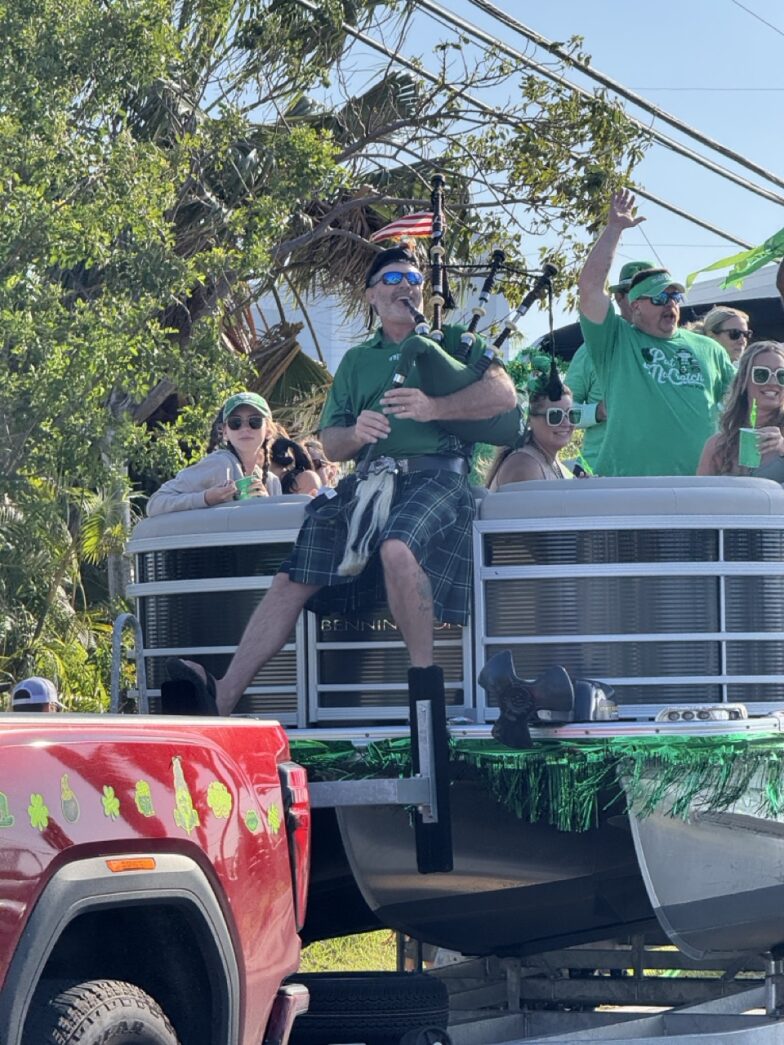 a group of people riding in the back of a truck