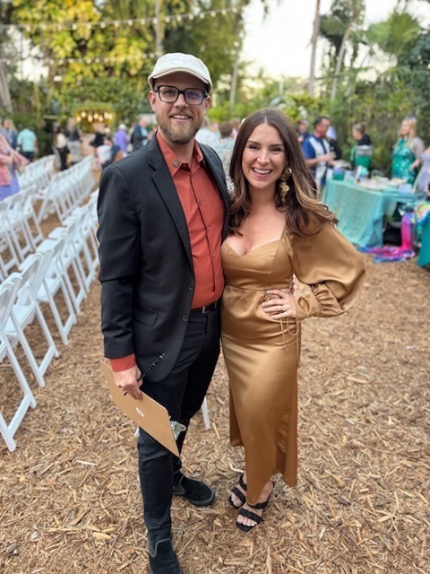a man and a woman standing next to each other
