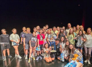 a group of people standing on a stage