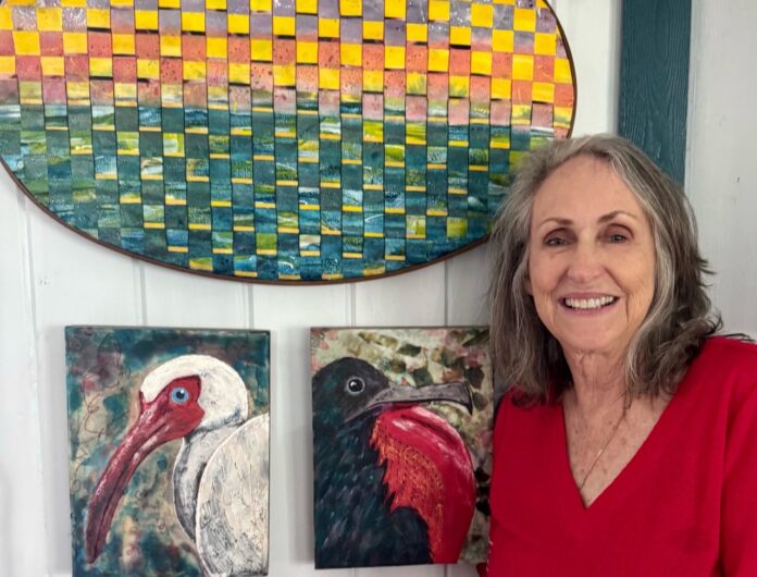 birds, sunset me Large a woman standing in front of some paintings