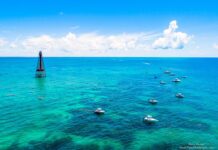 a group of boats floating on top of a large body of water