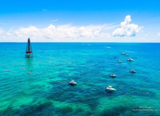 a group of boats floating on top of a large body of water