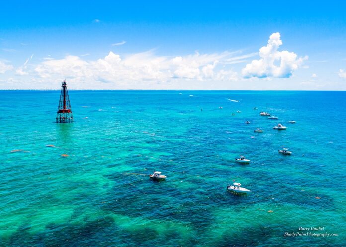 a group of boats floating on top of a large body of water