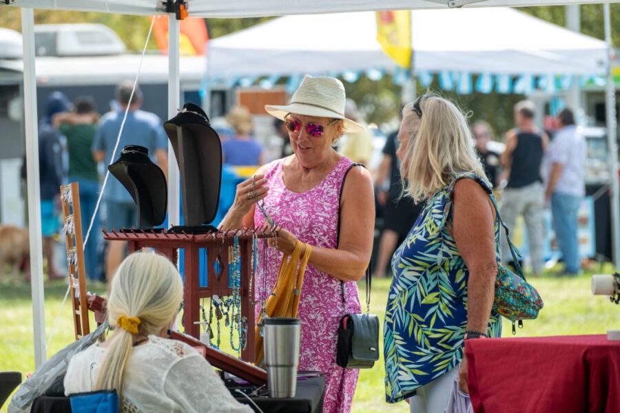 a group of people standing under a tent