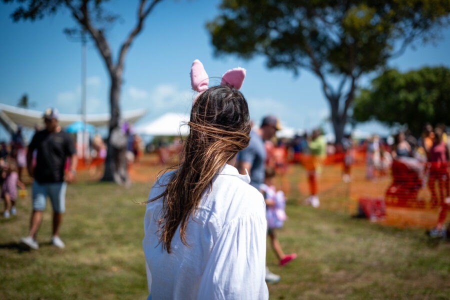 a woman with long hair wearing bunny ears