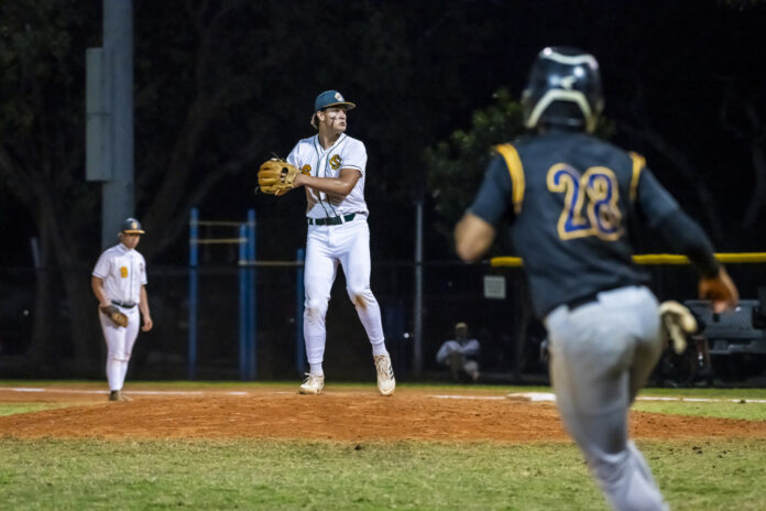 Campbell Lavoie 3 a baseball player throwing a ball to another player