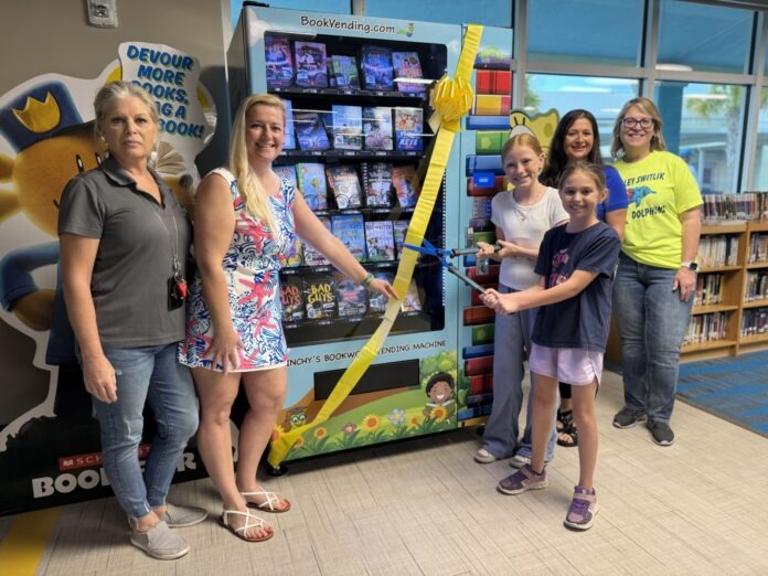a group of people standing in front of a book store
