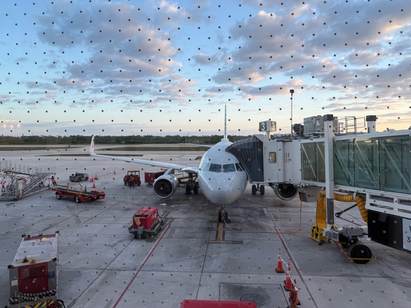 an airplane is parked on the tarmac at the airport
