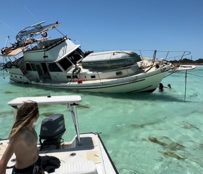 a woman is sitting on a boat in the water