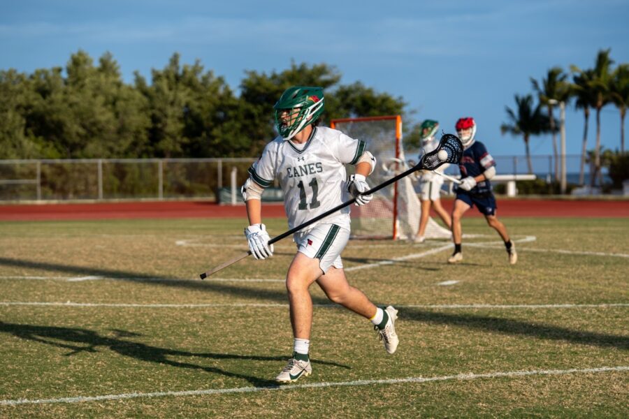 a group of people playing a game of lacrosse