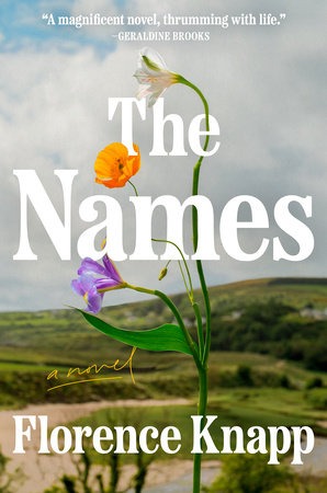 a book cover with a flower in the foreground