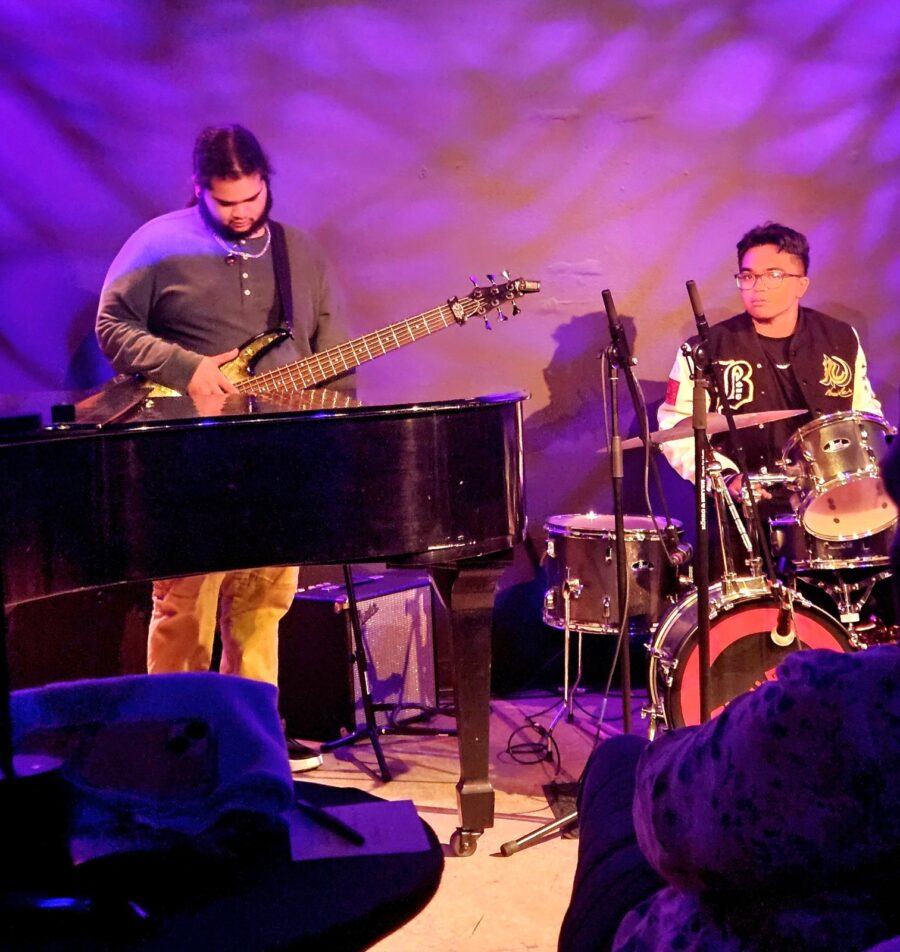 a group of men playing instruments on stage