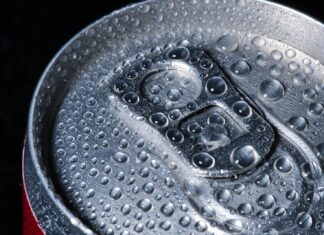 a can of soda with water droplets on it