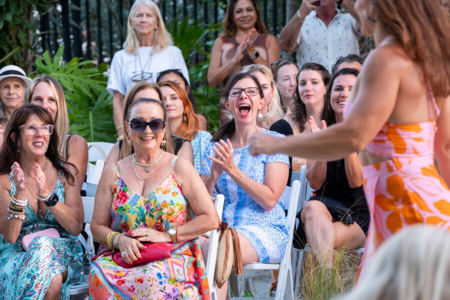 a group of women sitting next to each other