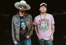 a couple of men standing next to each other