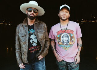 a couple of men standing next to each other