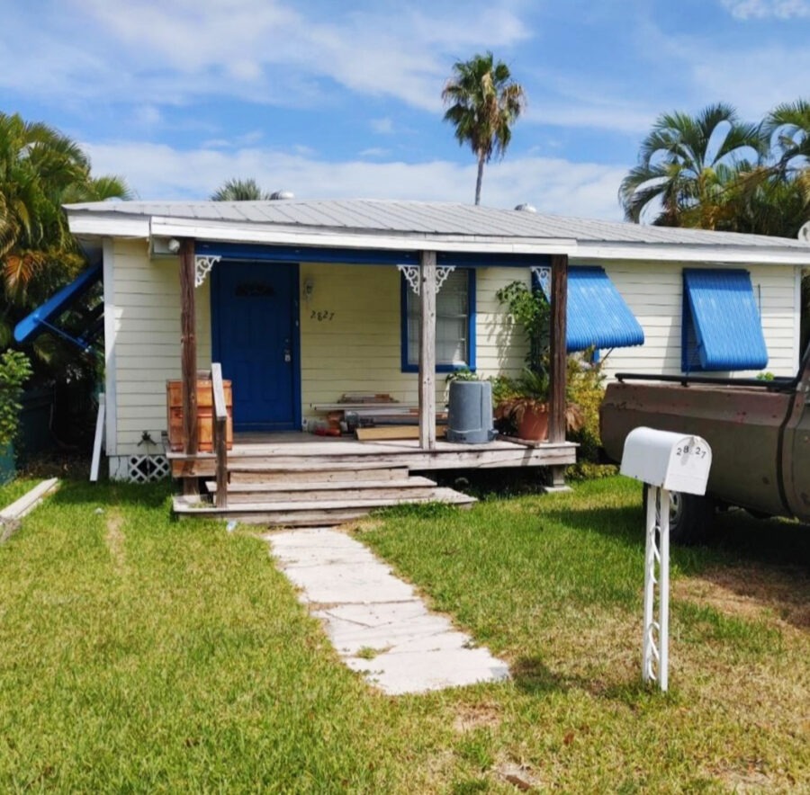 a house with a truck parked in front of it