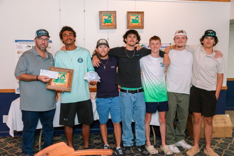 a group of young men standing next to each other