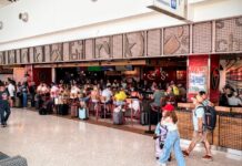 a large crowd of people in a shopping mall