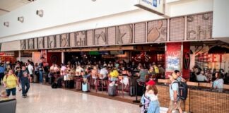 a large crowd of people in a shopping mall