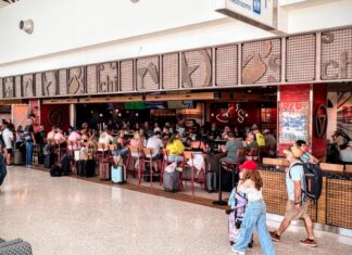 a large crowd of people in a shopping mall