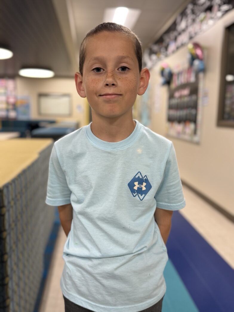 a young boy is standing in a store