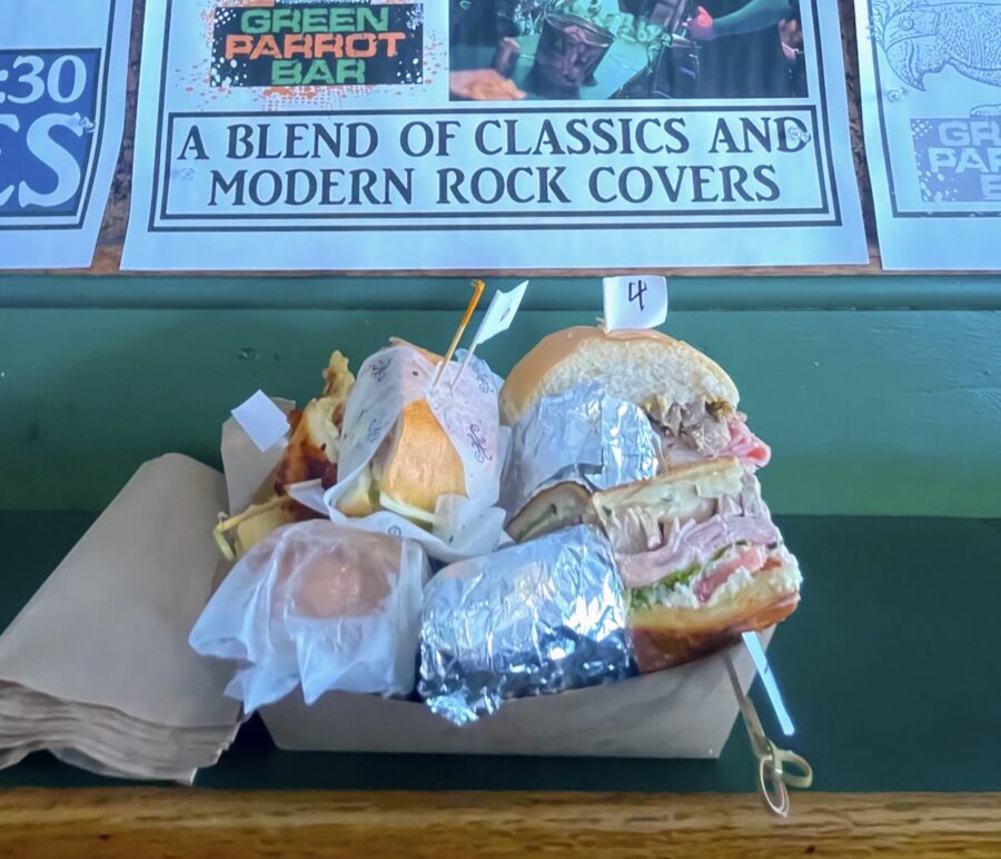 a bunch of sandwiches sitting on top of a table