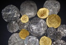 a bunch of coins sitting on top of a table
