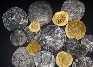 a bunch of coins sitting on top of a table