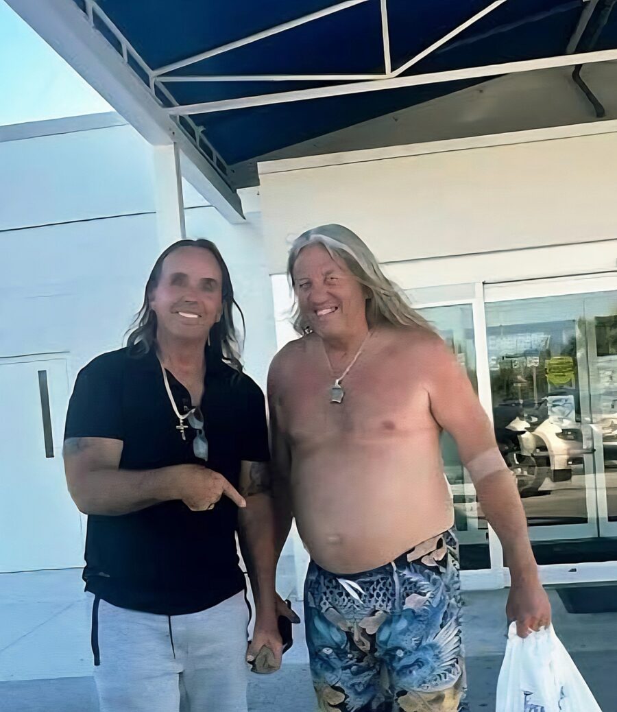 a couple of men standing next to each other