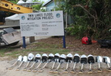 a sign that is next to a bunch of metal objects