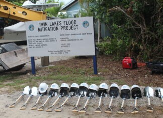 a sign that is next to a bunch of metal objects