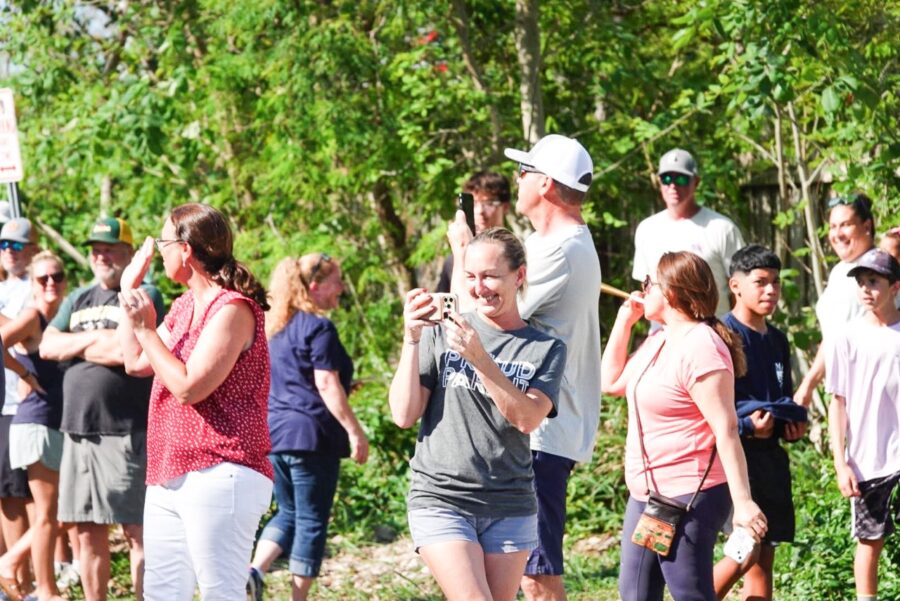 a group of people standing around each other