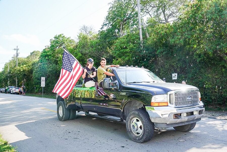 a couple of people that are in the back of a truck