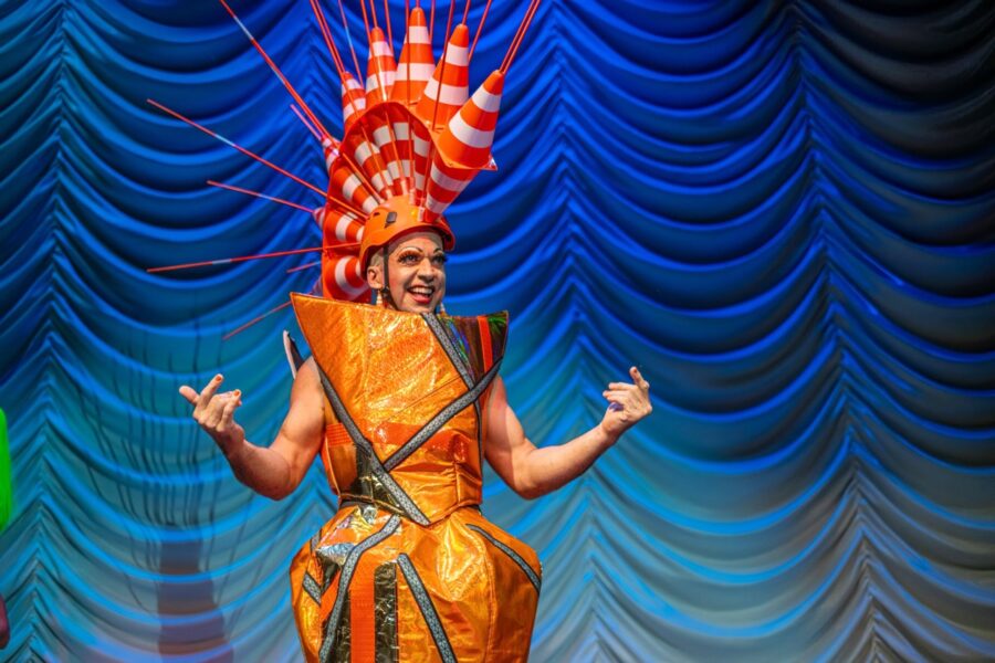 a man in a costume on a stage