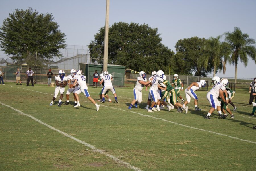 a group of people playing a game of football