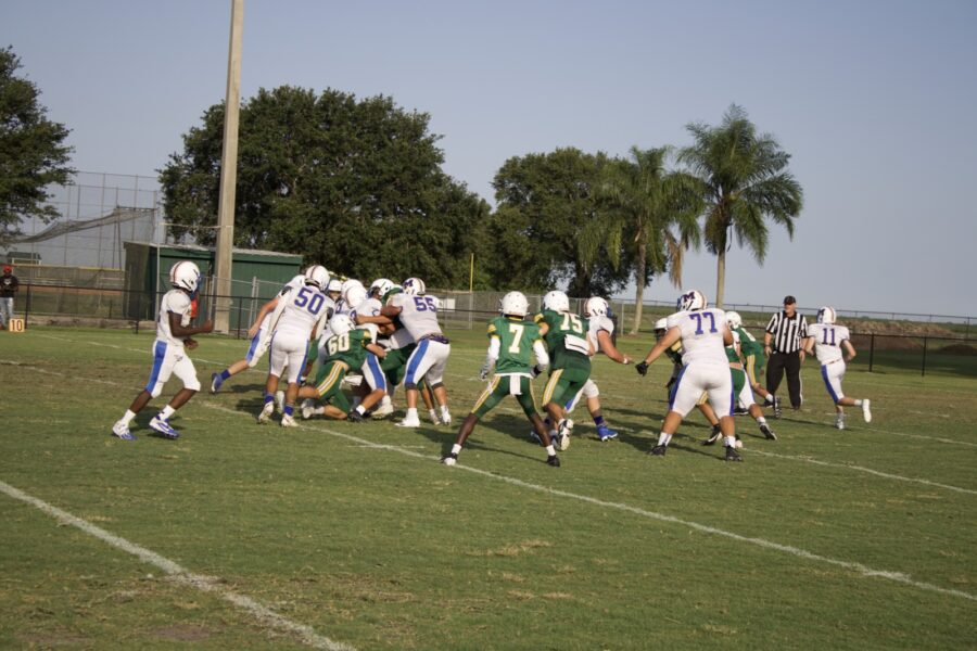 a group of people playing a game of football