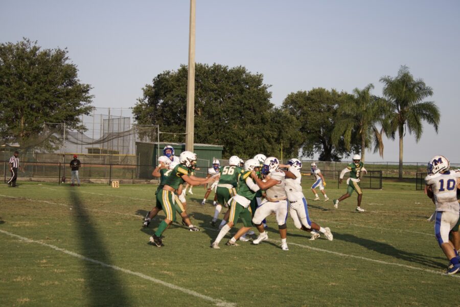 a group of people playing a game of football