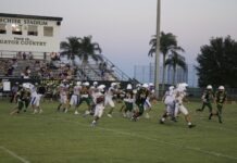 a group of people playing a game of football