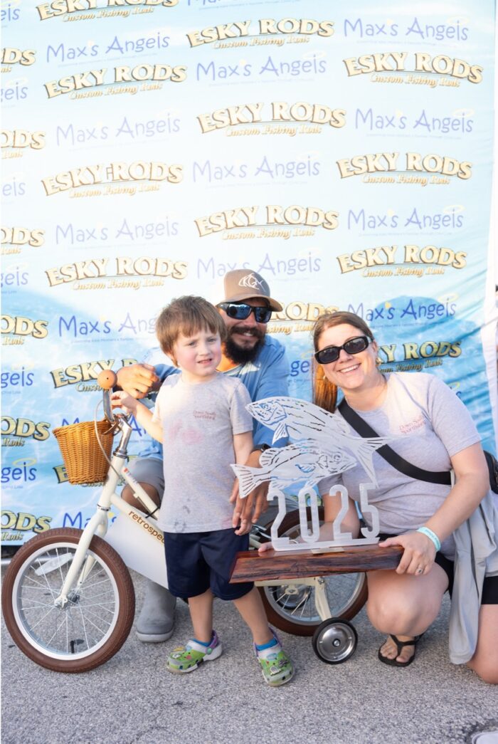 a man, woman and child posing for a picture