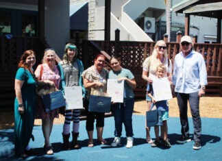 a group of people standing next to each other