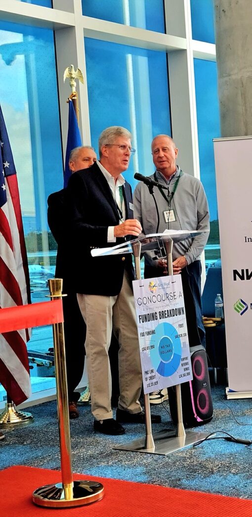 a group of people standing around a podium
